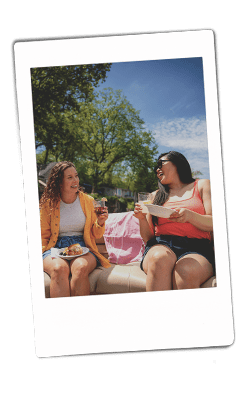 Instax picture of two women on a boat