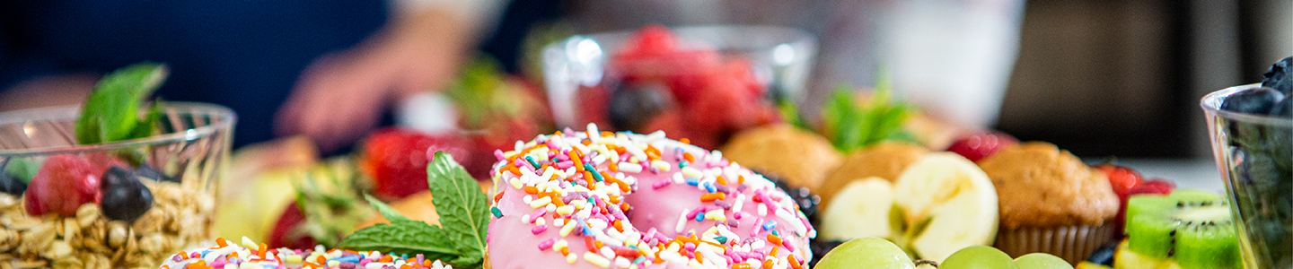 Assorted breakfast board with donuts and fruit