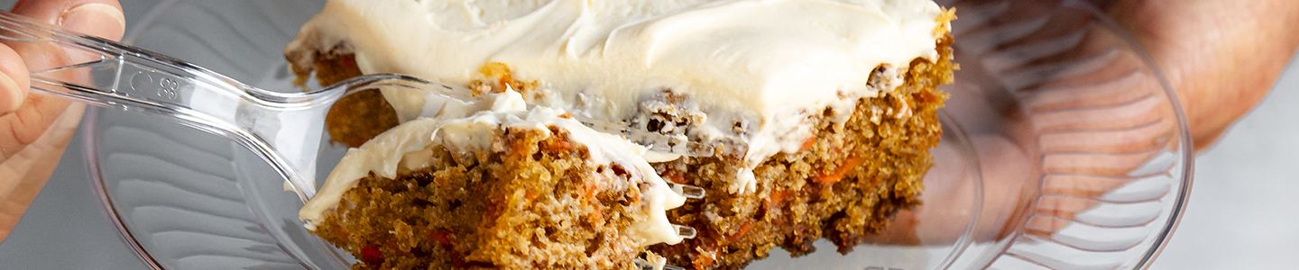 Frosted carrot cake on a Chinet crystal plate