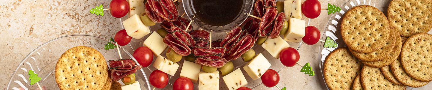 Holiday Charcuterie Wreath on a Chinet crystal wreath with balsamic glaze and crackers