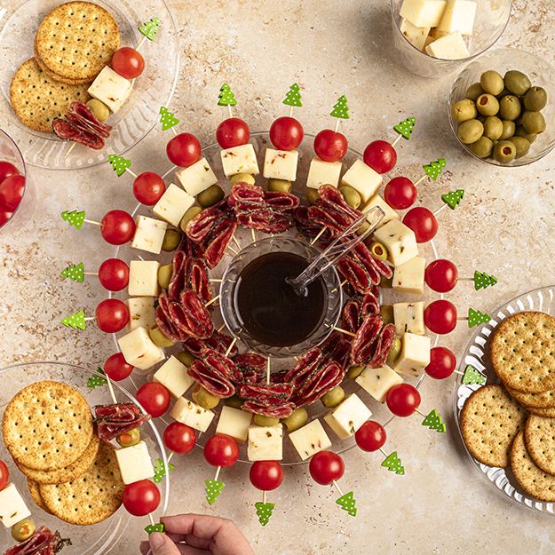 Holiday Charcuterie Wreath on a Chinet crystal wreath with balsamic glaze