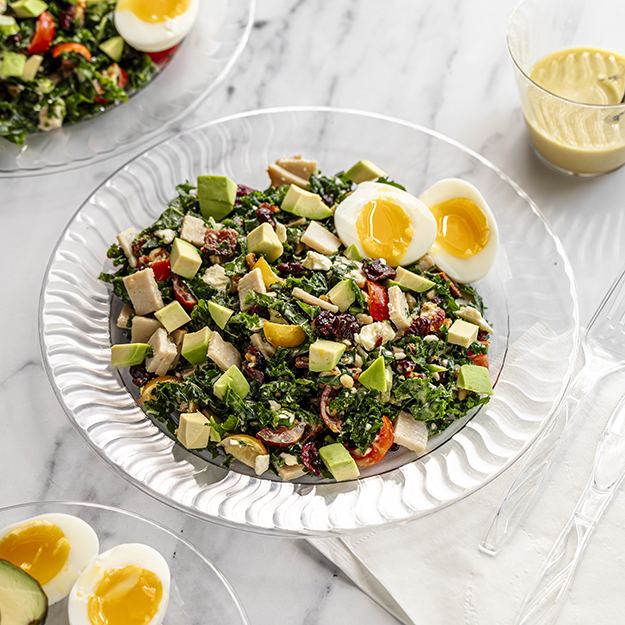 Chopped turkey cobb salad on a chinet crystal plate