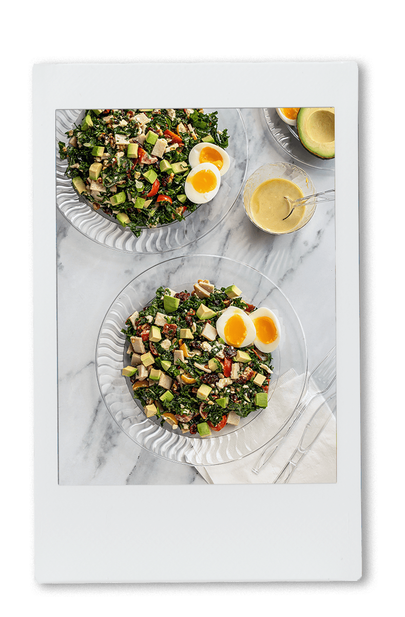 Instax of Chopped turkey cobb salad on a chinet crystal plate