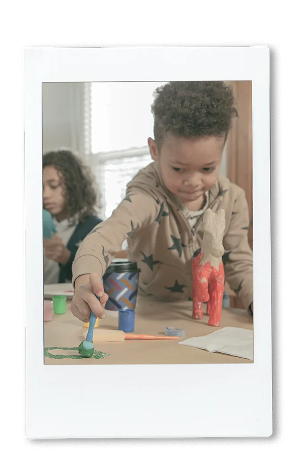 12oz Comfort Cup Instax of little kid playing