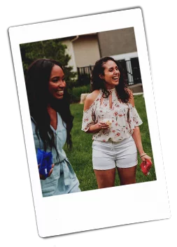 Instax picture of two women at an outdoor picnic