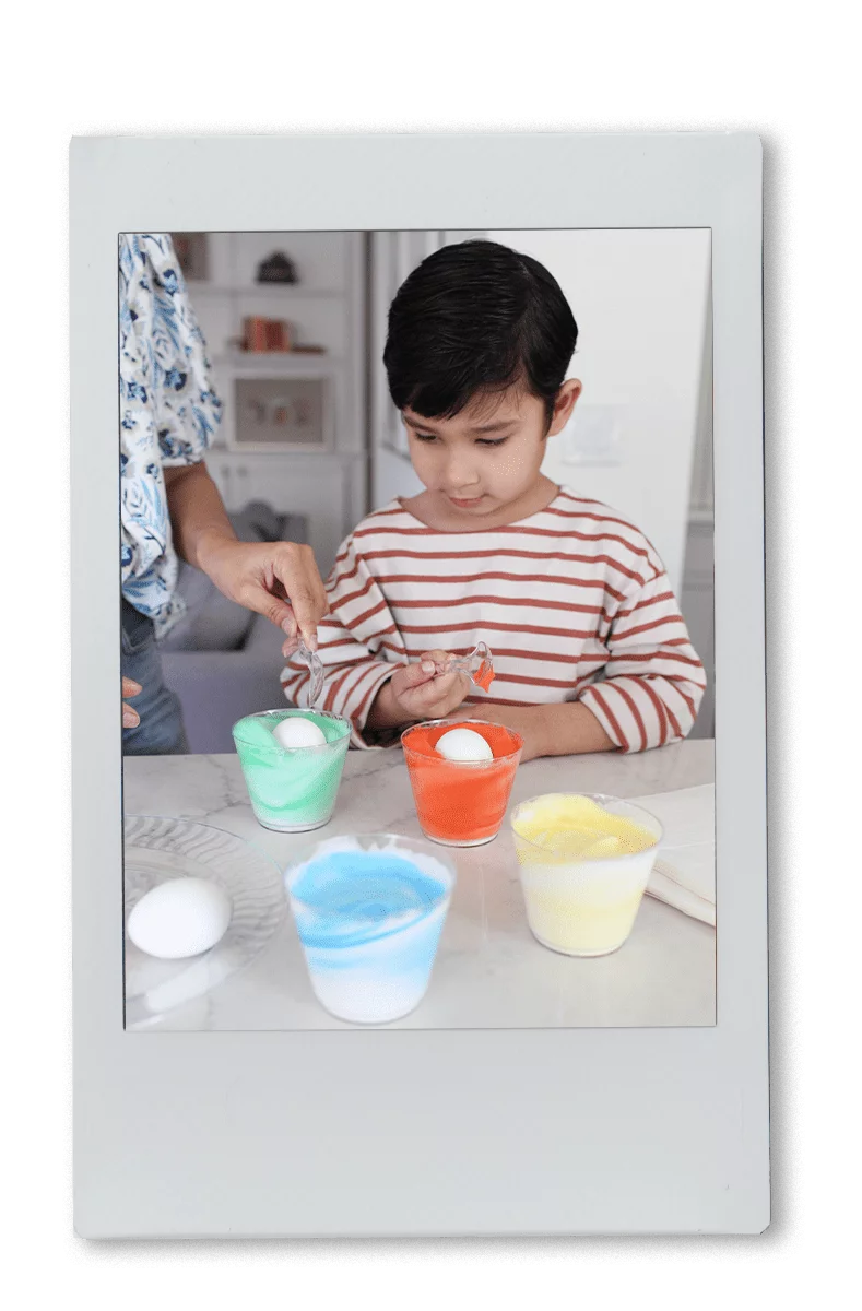 Instax of Mom & Son Dyeing Easter Eggs