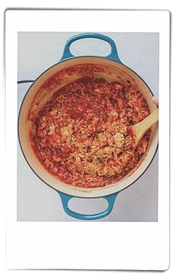 Crawfish jambalaya sauteeing in a pan