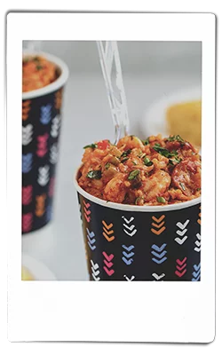 Instax picture of a crawfish jambalaya served in a Chinet Comfort cup