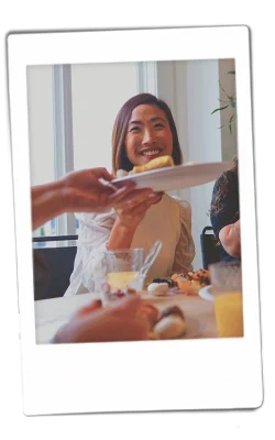 Instax of girl sharing food on a chinet plate