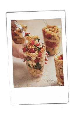 Instax picture of caprese pasta salad served in Chinet Crystal cups