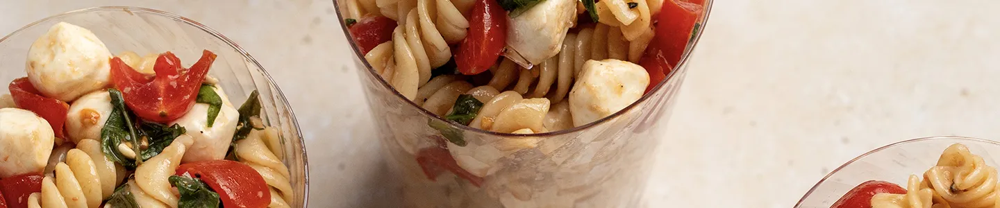 Caprese pasta salad served in Chinet Crystal cups