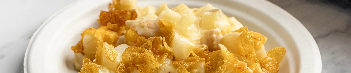 Cheesy potato bake served on a Chinet paper plate