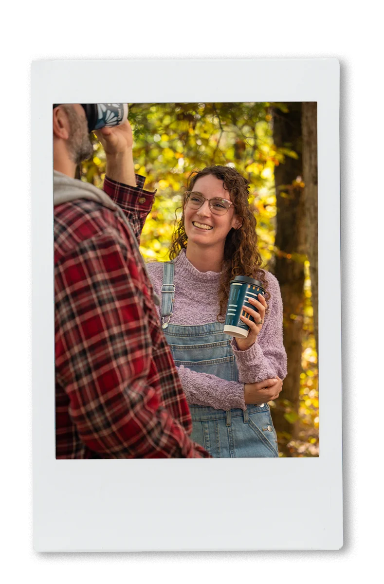 Instax of girl laughing and drinking out of a chinet comfort cup